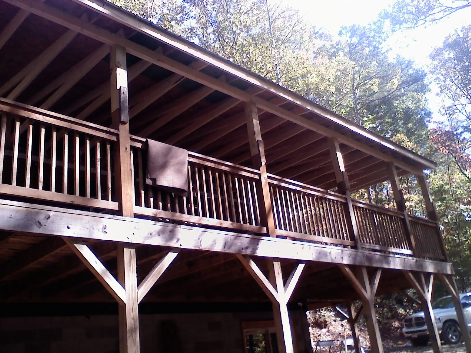 Timber framing under a new elevated porch and deck — Roof Leak Repair in Marine by Roofing Brothers